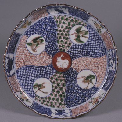 Flower-shaped Dish with Rabbit, Cranes, and Twisted Bands in Iroe Shonzui (Underglaze Blue and Overglaze Enamels) Image