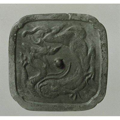 Four-Lobed Mirror with Coiled Dragon Image