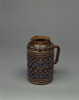 Beer Mug with Floral Decorations in Relief in Blue and Brown Glaze Image