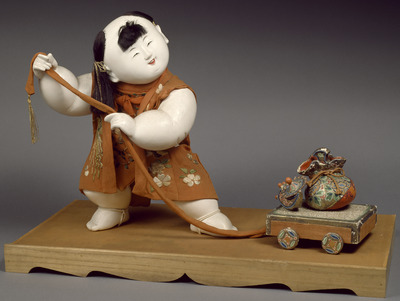 Boy in Kimono Pulling Treasure Cart; Gosho Doll Image