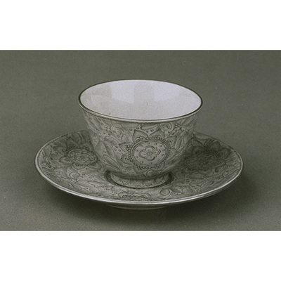 Tea Cup and Saucer with Flowering Plants in Light Red Glaze (Banko Ware) Image