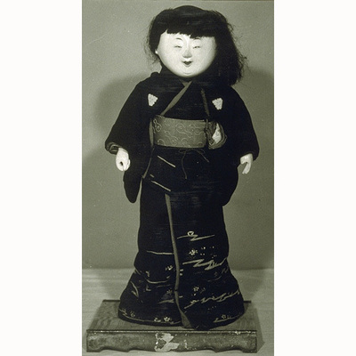 Child Wearing Black Robe; Ichimatsu Doll Image