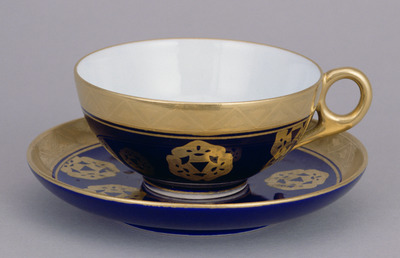 Tea Cup and Saucer with Mitsumatsu Pine Crests in Gold and Azure Glaze (Eiraku Zengoro Ceramic Ware from the Konoike Family) Image