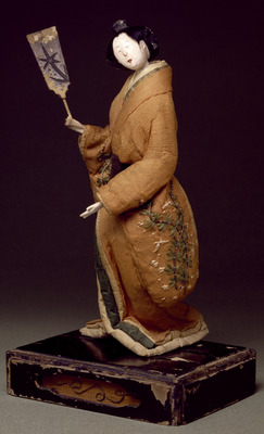 Woman Holding Battledore; Costume Doll Image