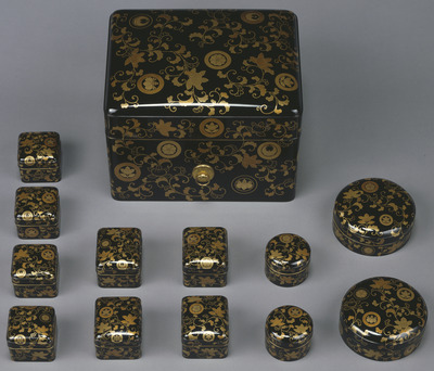 Twelve-Piece Toiletry Case with Mandarin Orange, Arabesque, and Scattered Crests in Makie Image